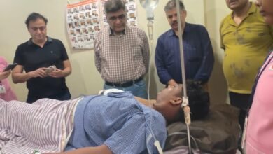 DRM Sanjeev Kumar enquiring about the health condition of an injured passenger at a private hospital in Raipur on Sunday 1