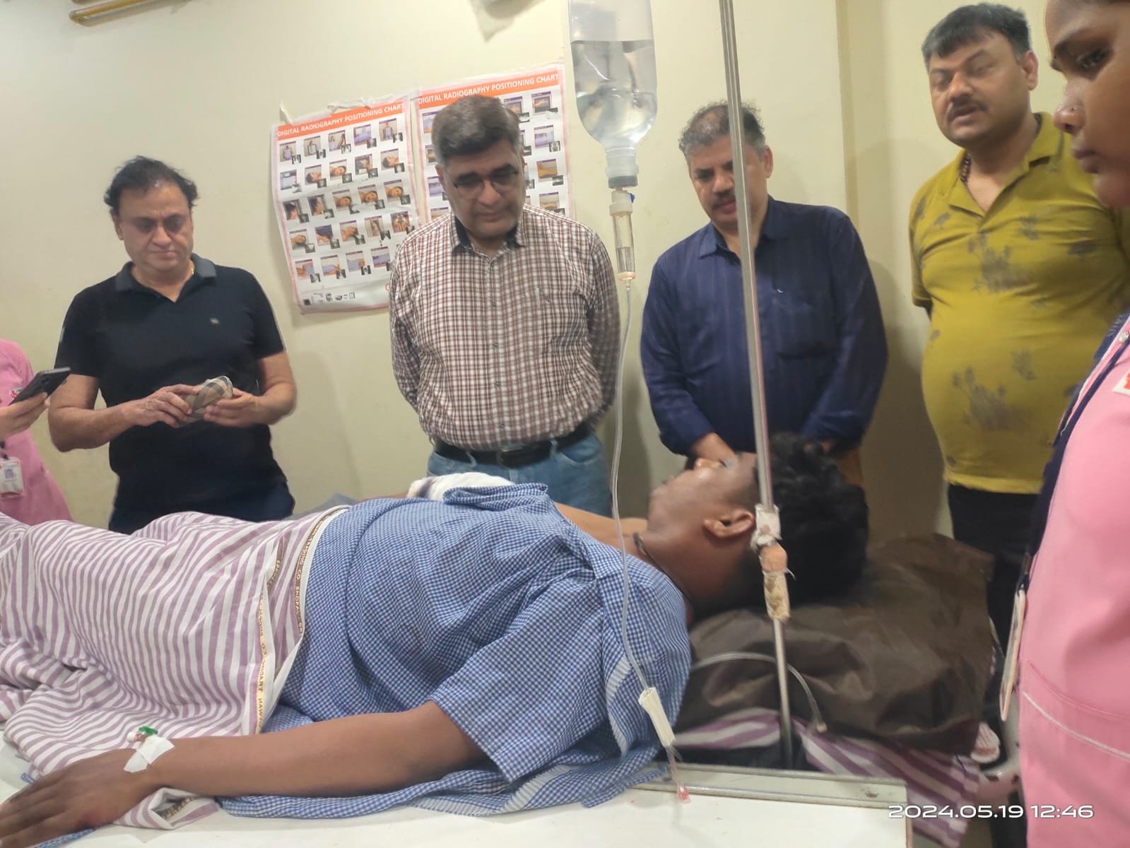 DRM Sanjeev Kumar enquiring about the health condition of an injured passenger at a private hospital in Raipur on Sunday
