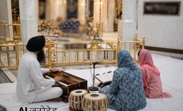sikh prayer gathering in ornate gurdwara 1775633898